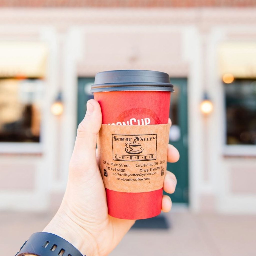 A photo of someone holding a cup of coffee from Scioto Valley Coffee in Ohio.