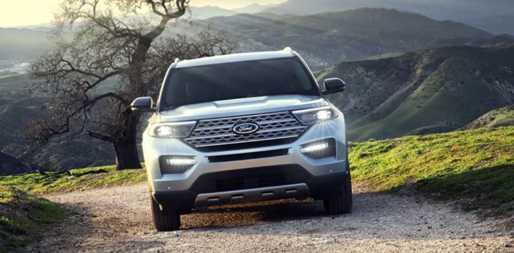A silver 2022 Ford Explorer driving on a mountain.