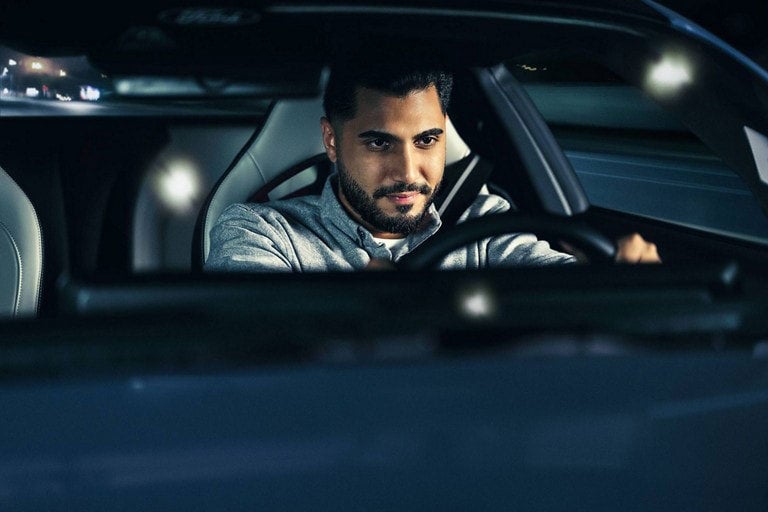 Person sitting in the driver’s seat of a parked 2024 Ford Mustang® coupe | Coughlin Ford of Circleville in Circleville OH